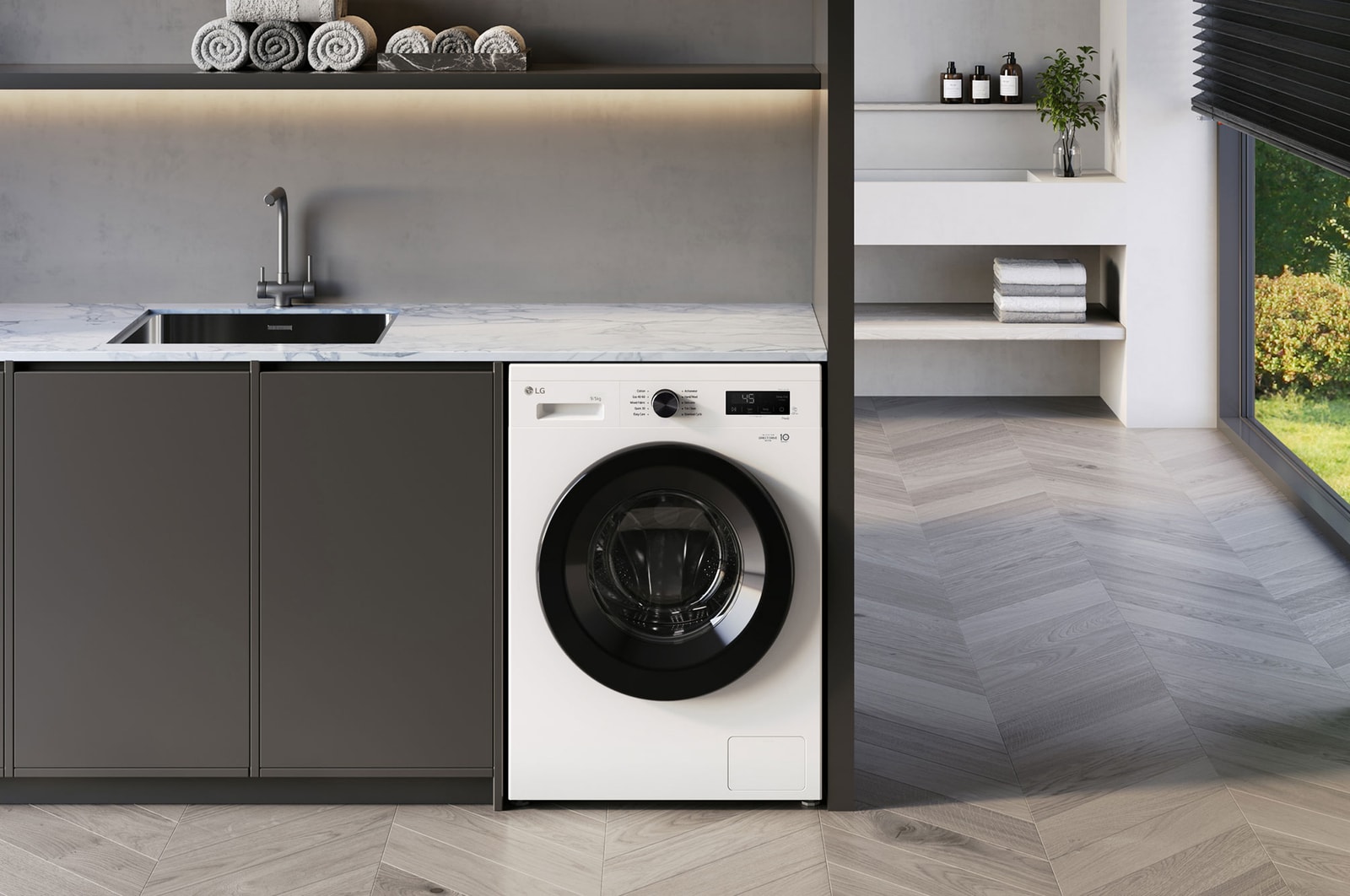 Die LG 8 kg Waschmaschine F4WB3085 in Essence White, unterbaufähig in einem modernen Waschraum installiert, mit Energieeffizienzklasse A.