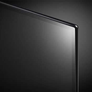 Nahaufnahme der oberen rechten Bildschirm-Ecke des LG OLED AI B4 4K Smart TV mit ultradünner Blende und glänzender Oberfläche.