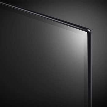 Nahaufnahme der oberen rechten Bildschirm-Ecke des LG OLED AI B4 4K Smart TV mit ultradünner Blende und glänzender Oberfläche.