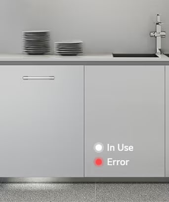 Built-in dishwasher in kitchen with white light showing operational status and red light indicating an error.