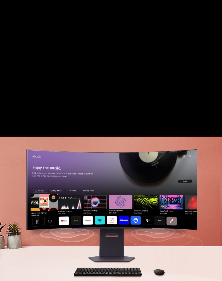 Der intelligente Monitor auf dem Tisch zeigt den Bildschirm der MUSIK APP an.	