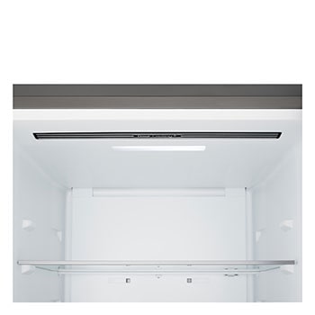 LG bottom freezer (GBBS726CPY) installed flush in tall warm beige wall with white arrows pointing to top side and front surfaces