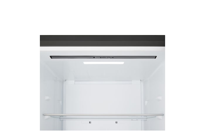 LG bottom freezer (GBBS726CEV) installed flush in tall warm beige wall with white arrows pointing to top side and front surfaces