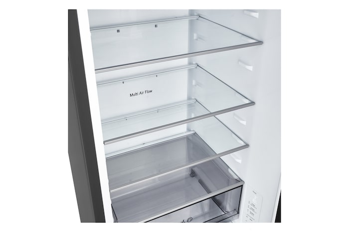 LG fridge freezer (GBBS726CEV) close up of wine rack holding four bottles and box of macarons with rack design magnified in circular image