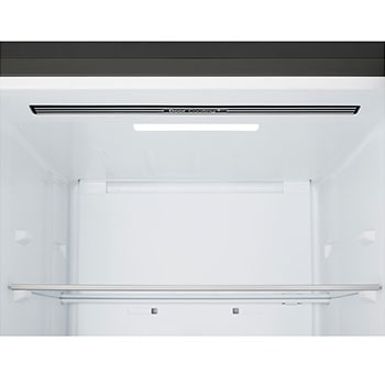 LG bottom freezer (GBBS726CEV) installed flush in tall warm beige wall with white arrows pointing to top side and front surfaces