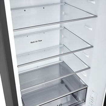 LG fridge freezer (GBBS726CEV) close up of wine rack holding four bottles and box of macarons with rack design magnified in circular image