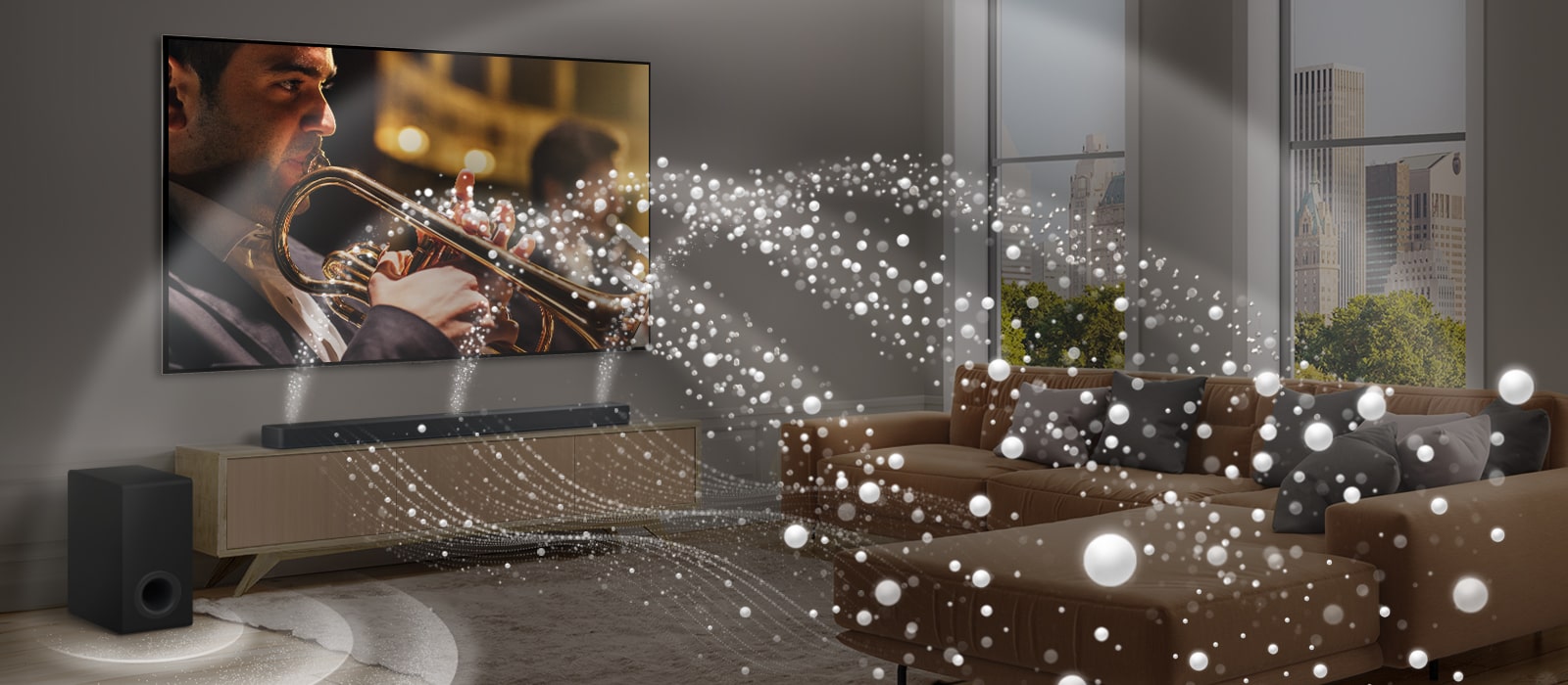 En LG Soundbar, et LG TV og en bashøjttaler i en moderne bylejlighed. LG Soundbaren udsender tre forgreninger af lydbølger, som er lavet af små, hvide dråber, der svæver langs gulvet. Flere hvide lydbølger af små, hvide dråber skyder op fra toppen af soundbaren. Ved siden af soundbaren står en bashøjttaler, der skaber en lydeffekt fra bunden. Tilsammen skaber de en kuppeleffekt på tværs af rummet.