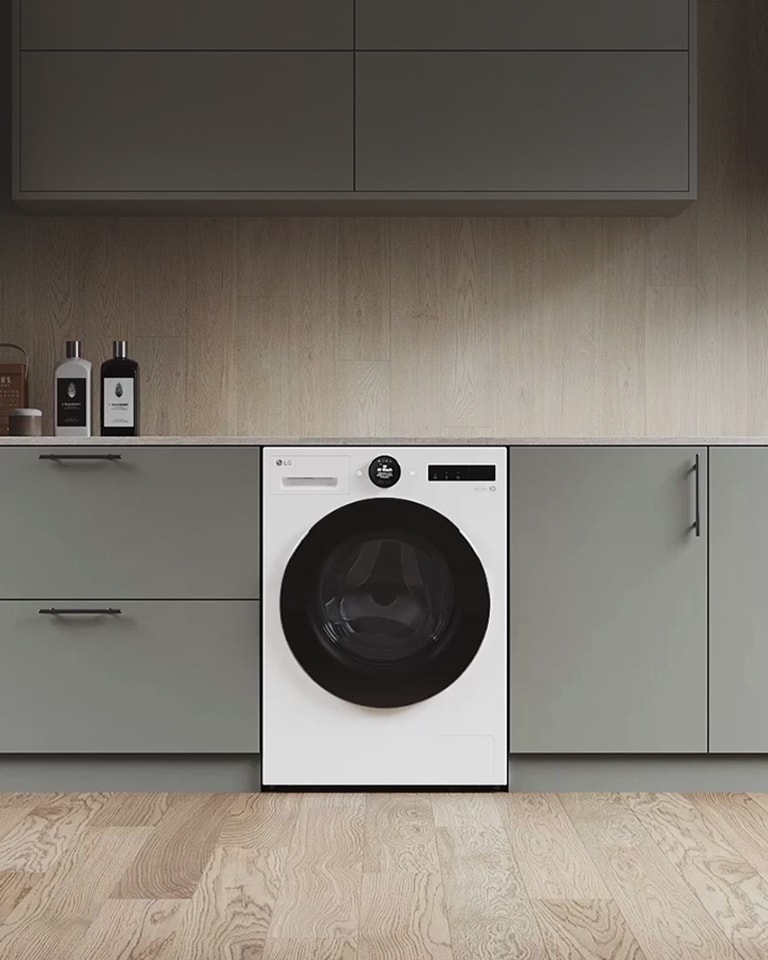 Der er zoomet ind på vaskemaskinen. Billedet ændres, og panelets side fremkommer med visning af tre farver: hvid, lysegrå og mørkegrå.