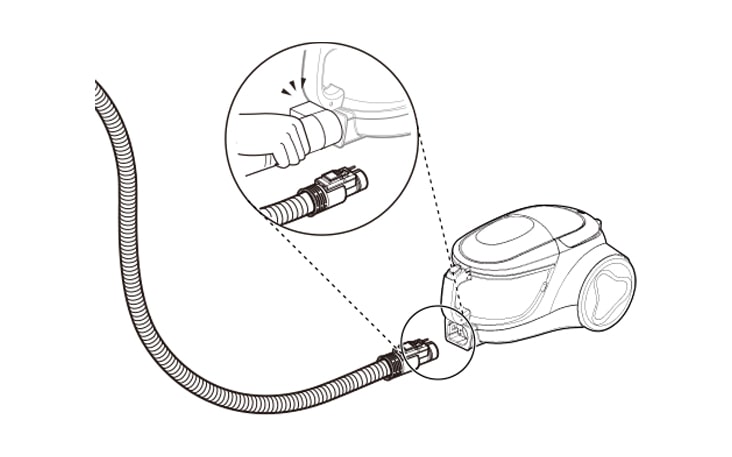 Vacuum cleaner hose attaches securely to the unit with a locking mechanism, ensuring stable and efficient operation.
