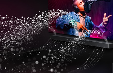 LG TV and LG Soundbar are in a black room playing a musical performance. White droplets representing soundwaves shoot upwards and forward from the soundbar.