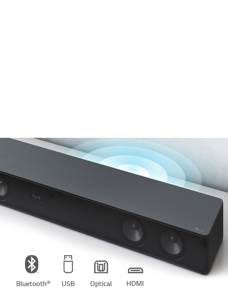 LG Sound Bar is on the white shelf. The Sound graphic coming out from the speaker. LG logo is shown on the right corner of the sound bar. It shows Bluethooth, USB, Optical, and HDMI icons.
