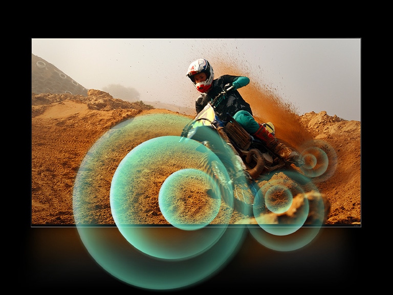 A man riding a motorbike on a dirt track with bright circle graphics around the motorbike.