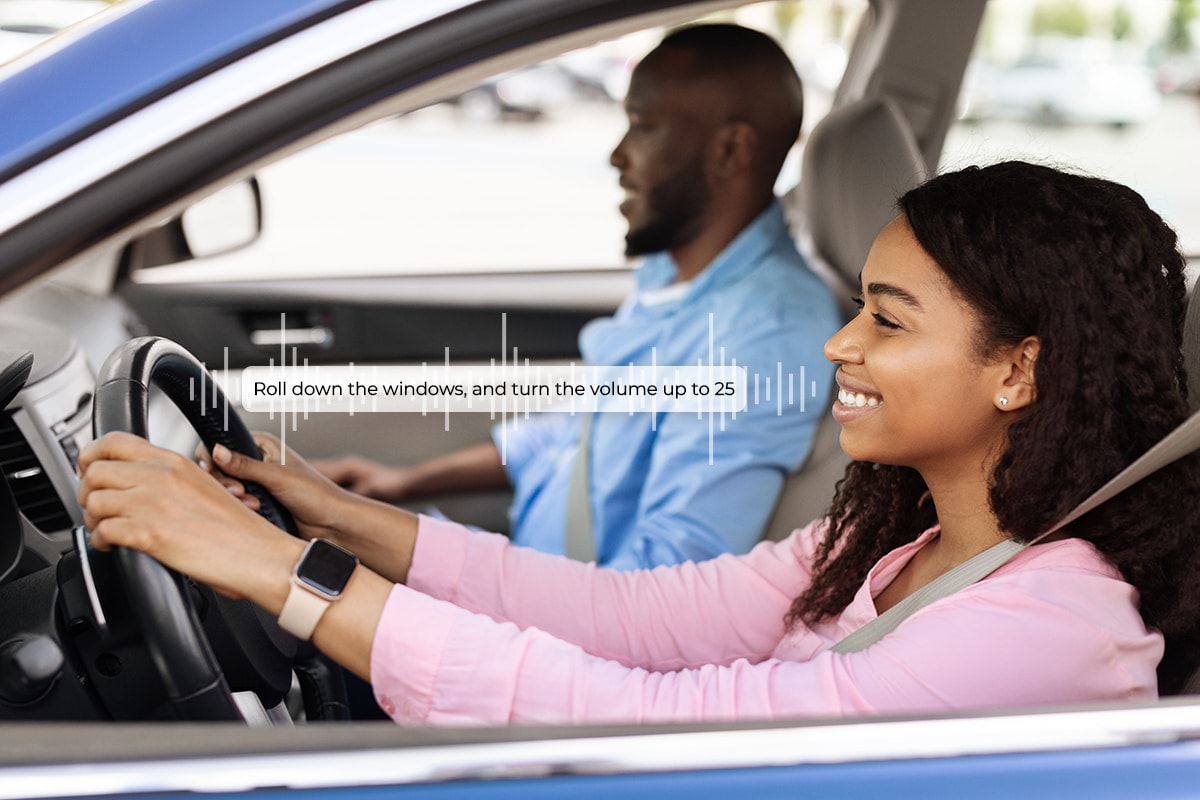 Imagen de un hombre y una mujer conduciendo utilizando la IA