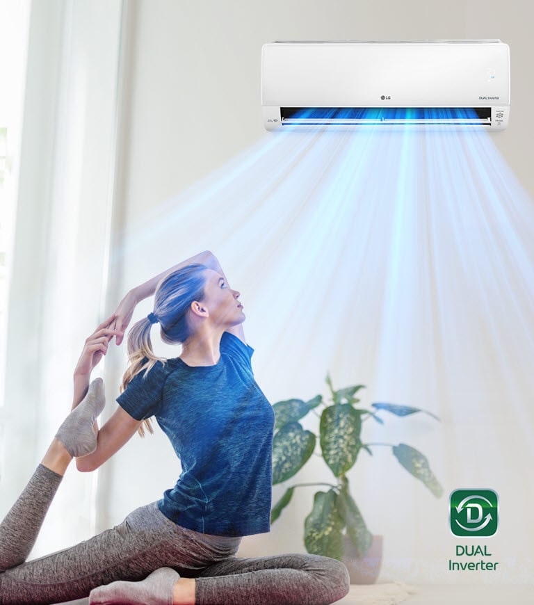 A woman is stretching on the floor. In the background is the air conditioner and blue air flows out over the woman and the room. The Dual Inverter logo is in the bottom right corner.