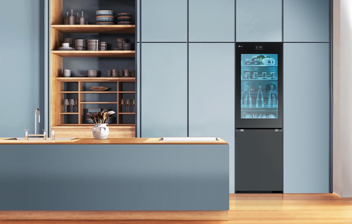 An image of a refrigerator placed in a blue-toned kitchen.