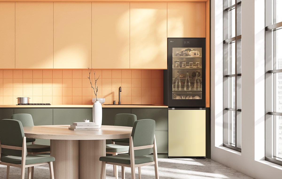 An image of a refrigerator placed in a yellow-toned kitchen.