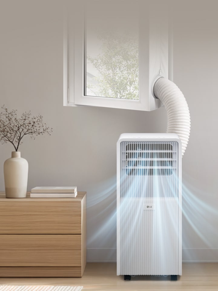 Aire acondicionado portátil LG en un dormitorio moderno con tubo de evacuación flexible.
