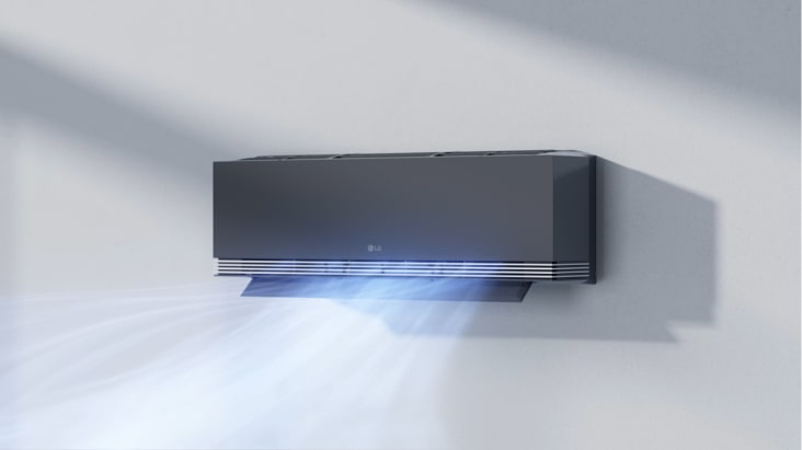 El aire acondicionado LG proporciona un flujo de aire suave y delicado en un salón moderno para crear un ambiente confortable. El aire acondicionado LG proporciona un flujo de aire suave y delicado en un salón moderno para crear un ambiente confortable.