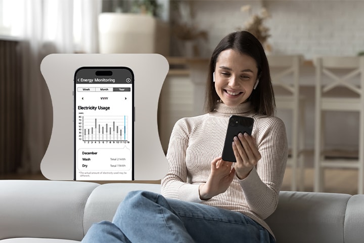 Una mujer controlando de forma remota la secadora LG a través de la aplicación ThinQ.