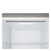 LG fridge freezer (GBBS323CPY) built into dark brown cabinetry with window and sofa on left and sink on right