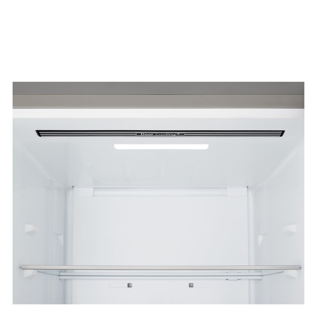 LG fridge freezer (GBBS323CPY) built into dark brown cabinetry with window and sofa on left and sink on right
