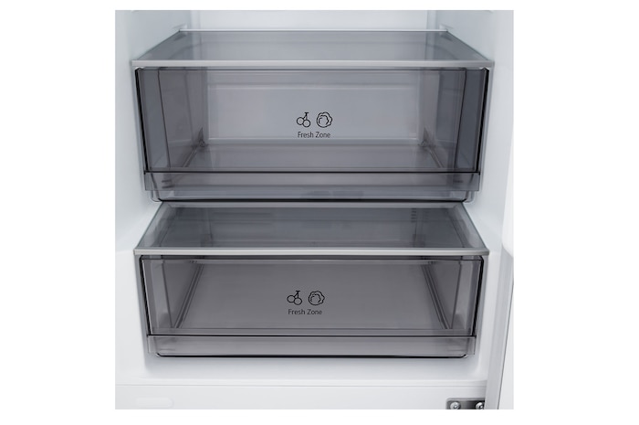 LG fridge freezer (GBBSJ10DEP) built into dark brown cabinetry with window and sofa on left and sink on right
