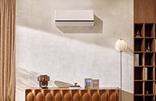 LG air conditioner mounted on the wall. A product cut is shown in the bottom right corner of the image.
