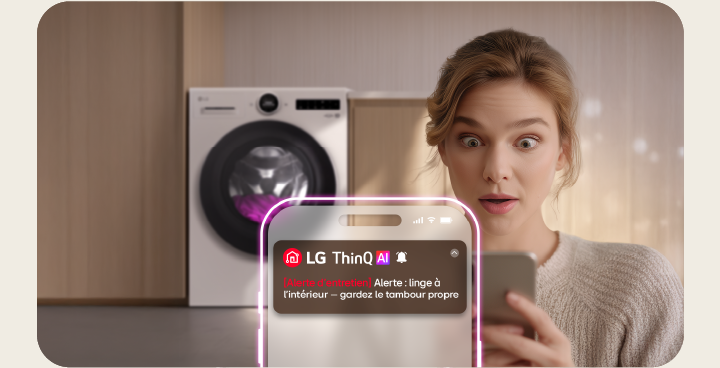 LG washer drum with clothes and phone alert for laundry left inside during tub clean cycle