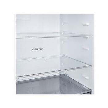 Congélateur bas LG (gbbsj20dpy) installé encastré dans un grand mur beige chaud avec des flèches blanches pointant vers le haut et les surfaces avant