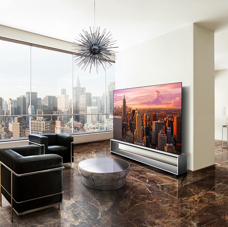 LG SIGNATURE OLED 8K is placed on the Marron Emperador marble floor, with the city backdrop.