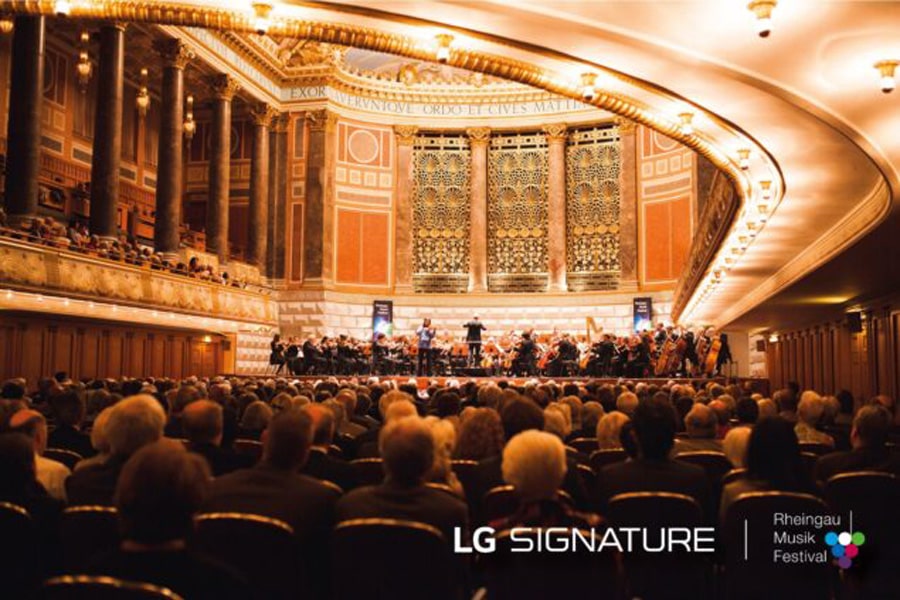 Audience watches an orchestra perform onstage at Kurhaus Wiesbaden.