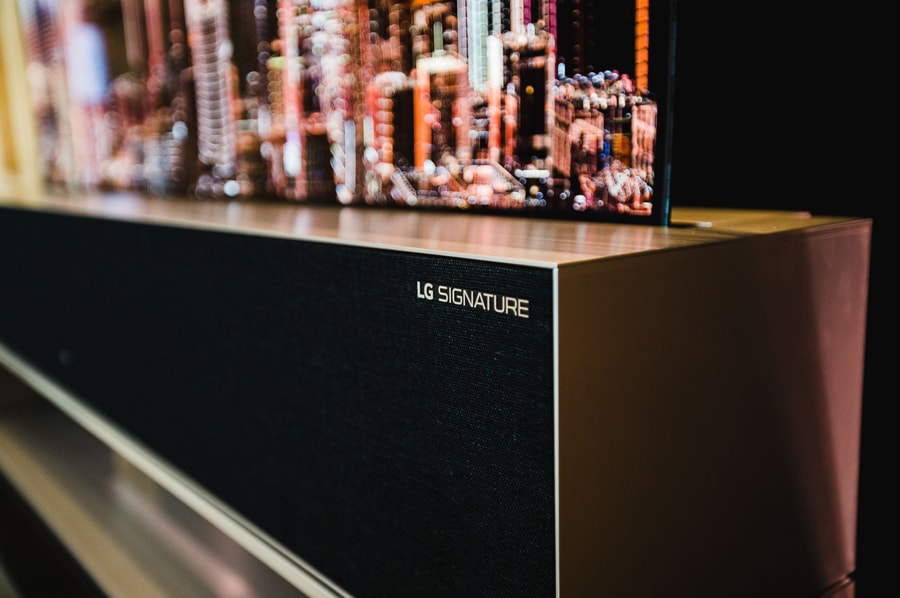 A close-up shot of the LG SIGNATURE rollable TV