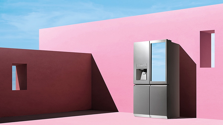 lg signature refrigerator on the artistic pink wall