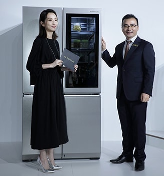 people are standing in front of lg signatrure refrigerator at lanching event in taiwan