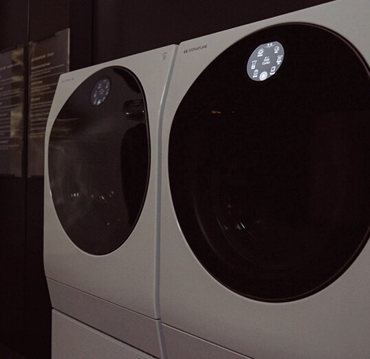 close shot of lg signature washing machine's upper body showing its door and quick circle at ces 2019