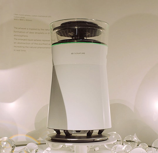 front view of lg signature air purifier displayed with some water droplet ornaments at ces 2019