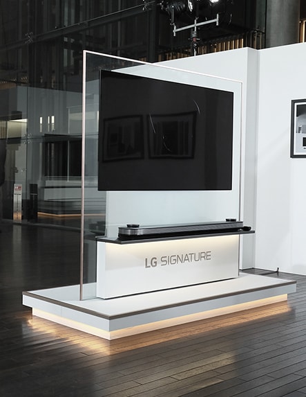 lg signature oled tv w is hung on the transparent glass in the right middle of the launching event in tokyo japan