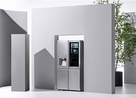 lg signature refrigerator is displayed right under the square wall with some architect and plant objects around it