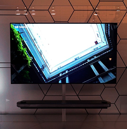 LG SIGNATURE W9 is hung on the glass wall at IFA 2019