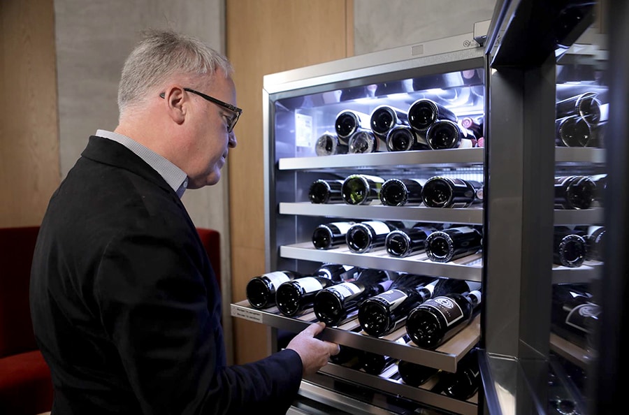 James Suckling is taking the wines out of the LG SIGNATURE Wine Cellar.