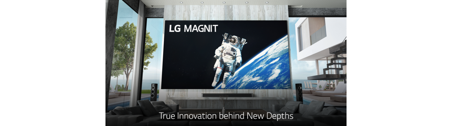 LG MAGNIT hanging on the wall of a modern living room as it displays an astronaut floating in space