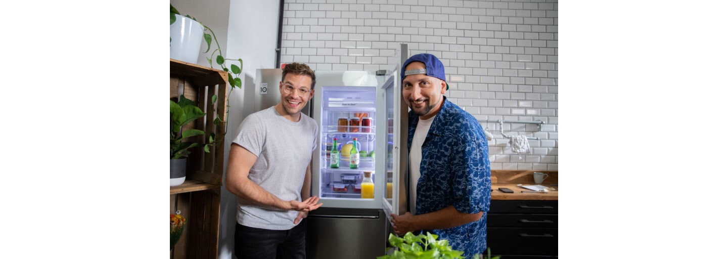 DJ Mosaken and Jakob Glanzer, the host of LG KitchenLife Stories, posing with the LG InstaView Door-in-Door refrigerator.