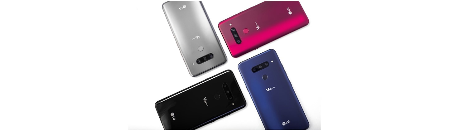 Four LG V40 ThinQ smartphones in New Aurora Black, New Platinum Grey, New Moroccan Blue and Carmine Red are placed in a brick pattern.