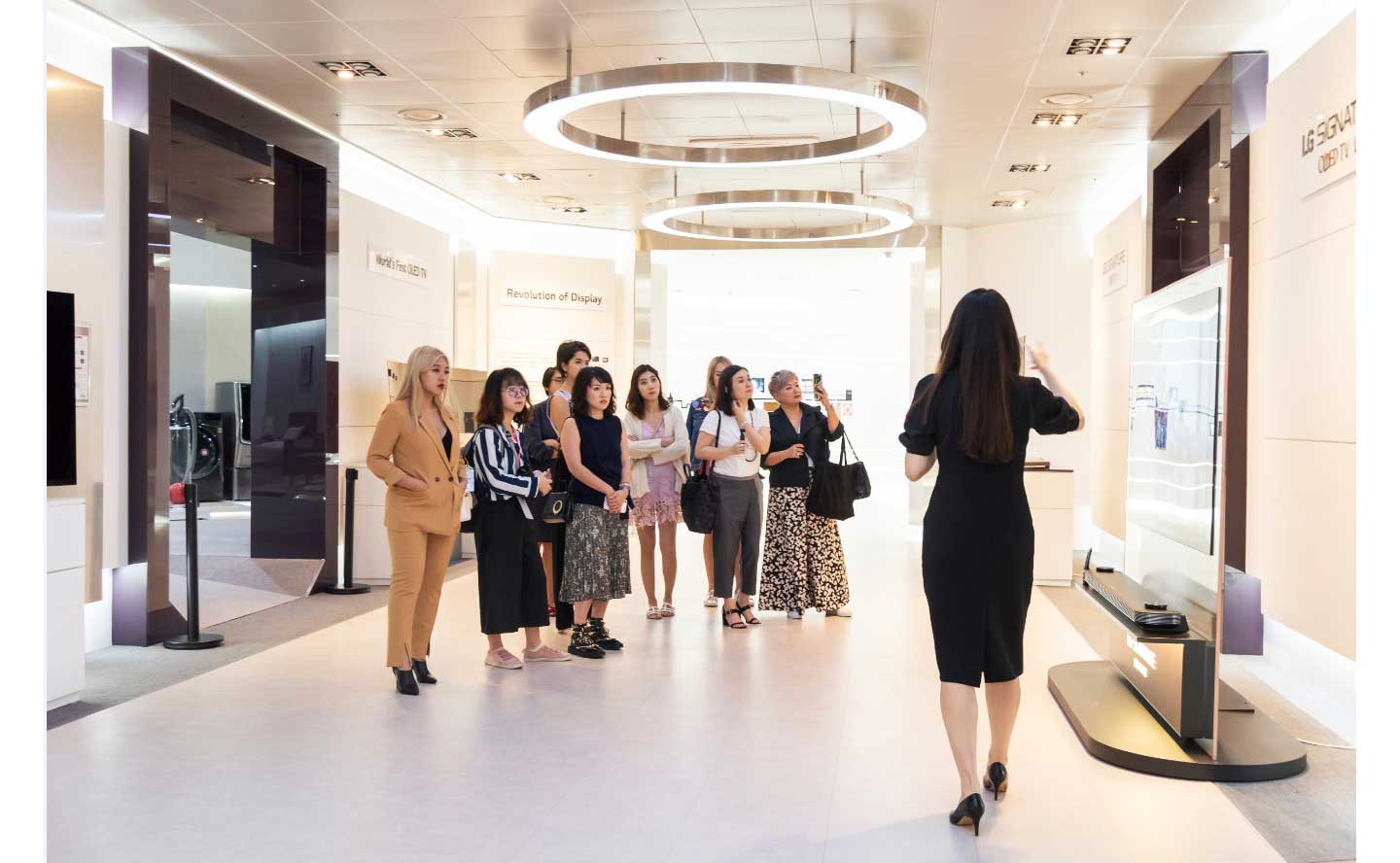 Singaporean journalists and social media influencers stand next to each other during their visit to LG’s headquarters in South Korea.