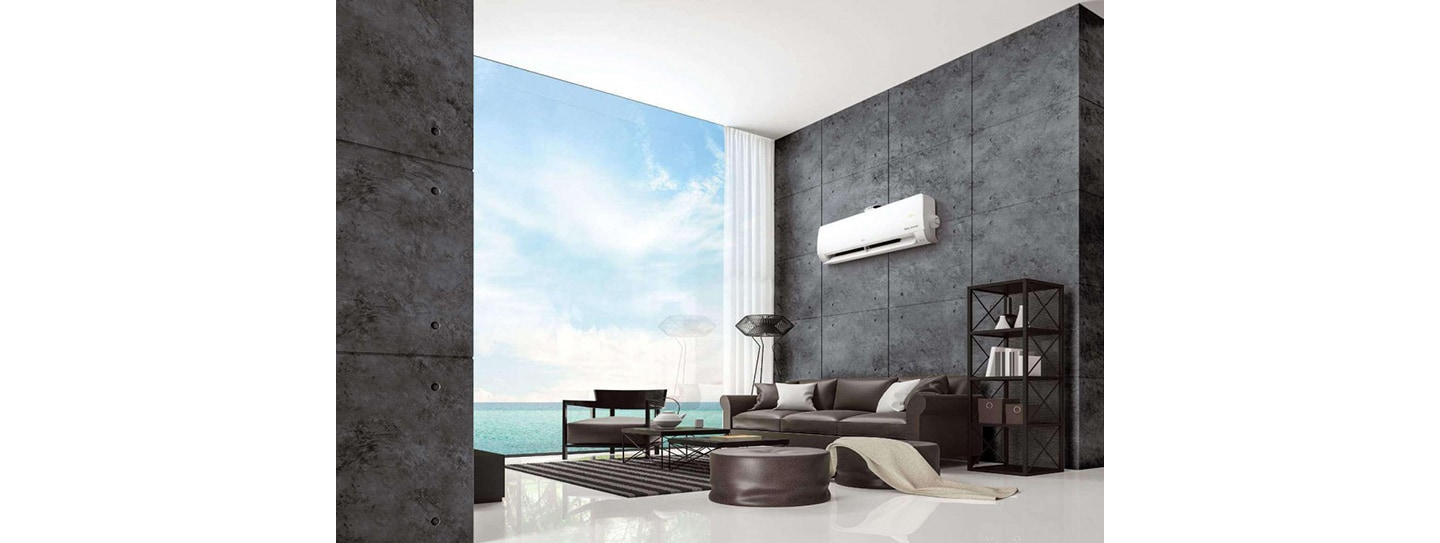 LG DUAL COOL placed on the wall of a modern living room by the ocean