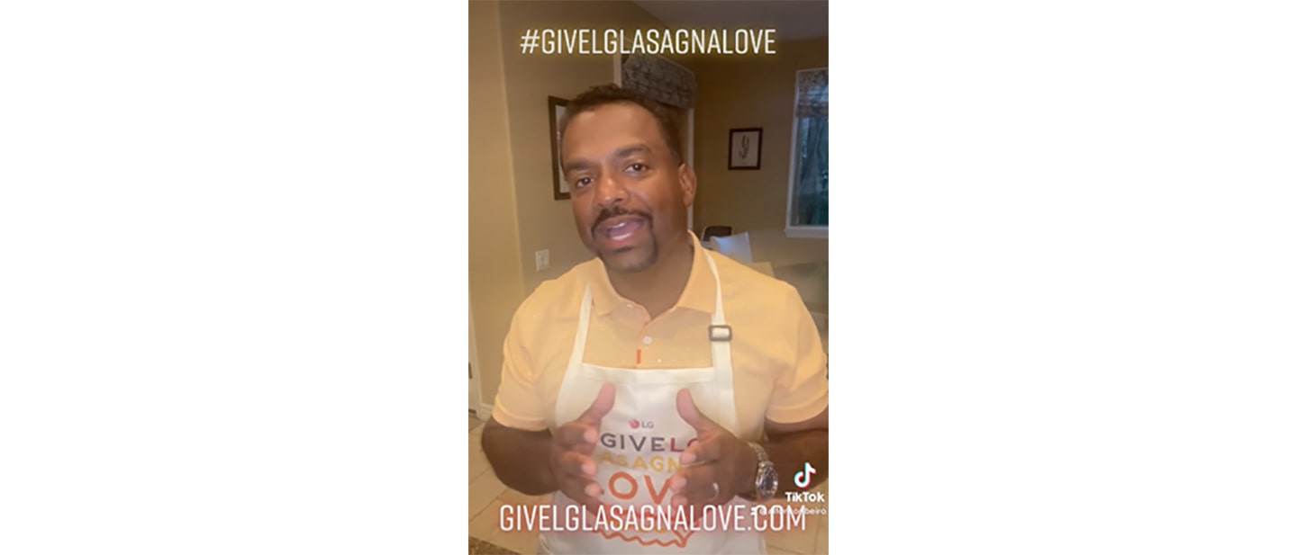 American actor Alfonso Ribeiro taking on the LG Lasagna TikTok challenge with the hashtag #GiveLGLasagnaLove above.