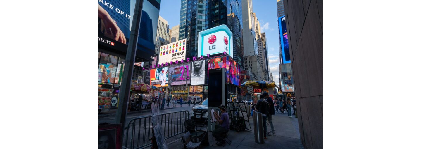 A busy Times Square, New York City, with billboards and LG’s logo lighting up the world-famous landmark.