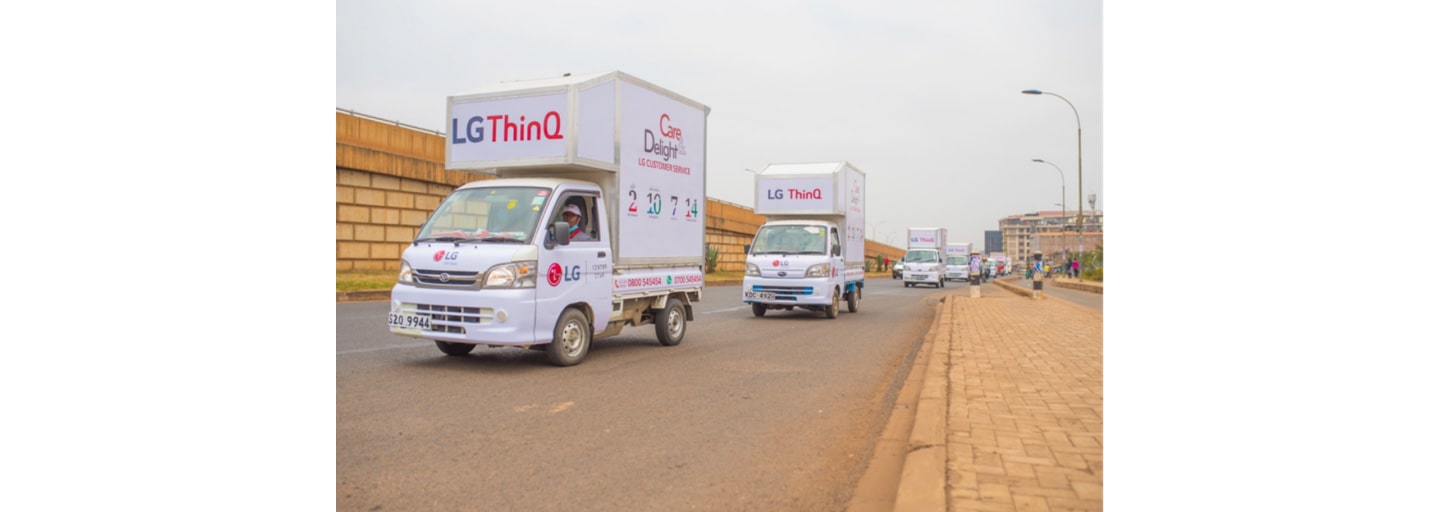 LG trucks riding in a convoy for The Last Mile program which provides appliance repair services.