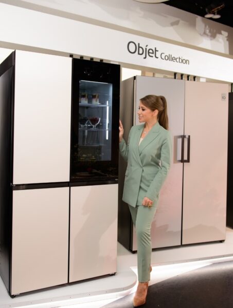 TV host Yulia Baranovskaya posing with one of the LG Objet refrigerators on display.