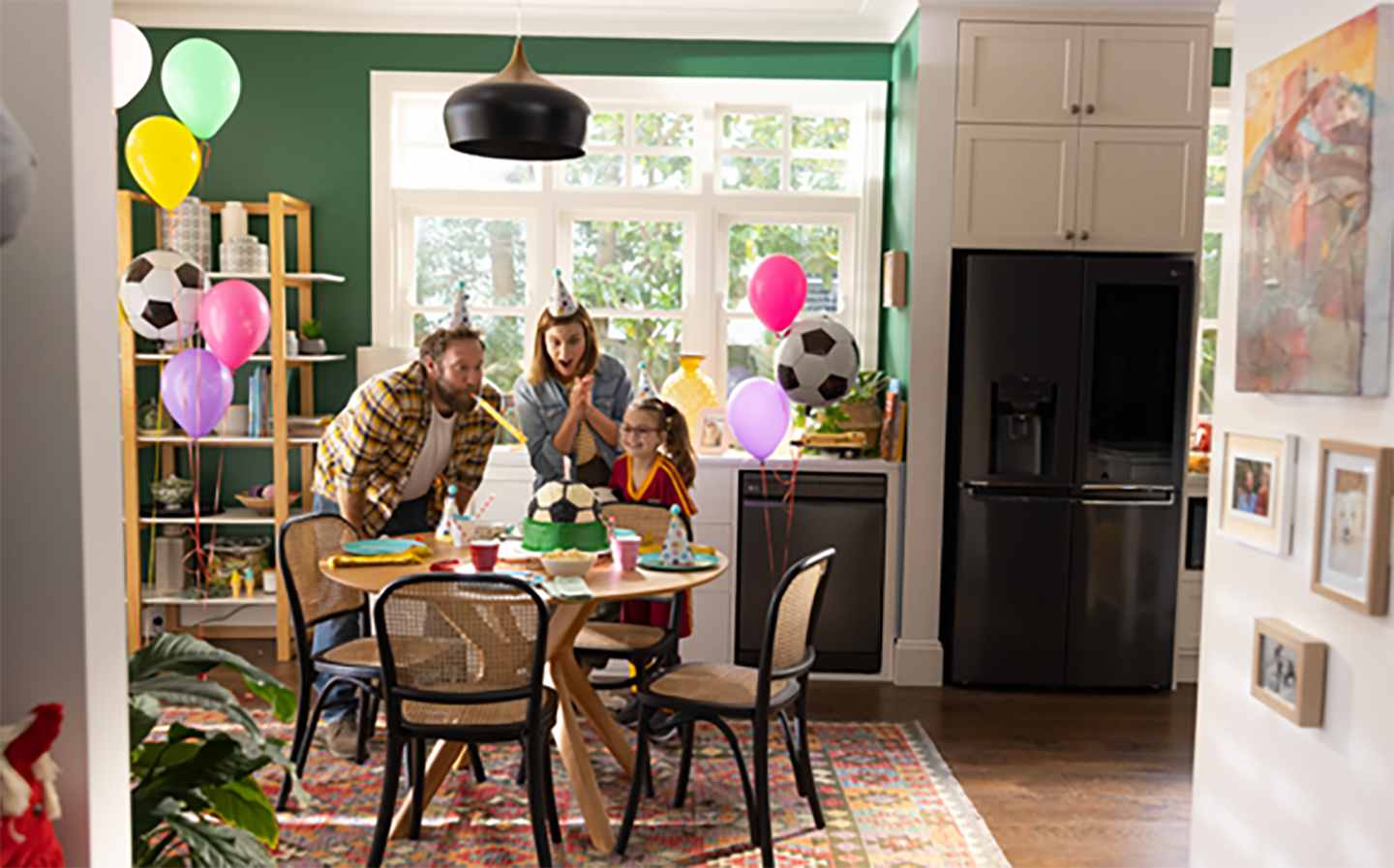 A family of three celebrating a birthday at home.